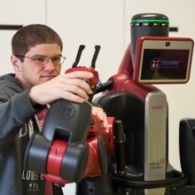 Student with Baxter the robot